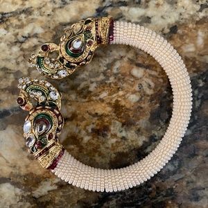 Faux pearl bracelet with peacocks